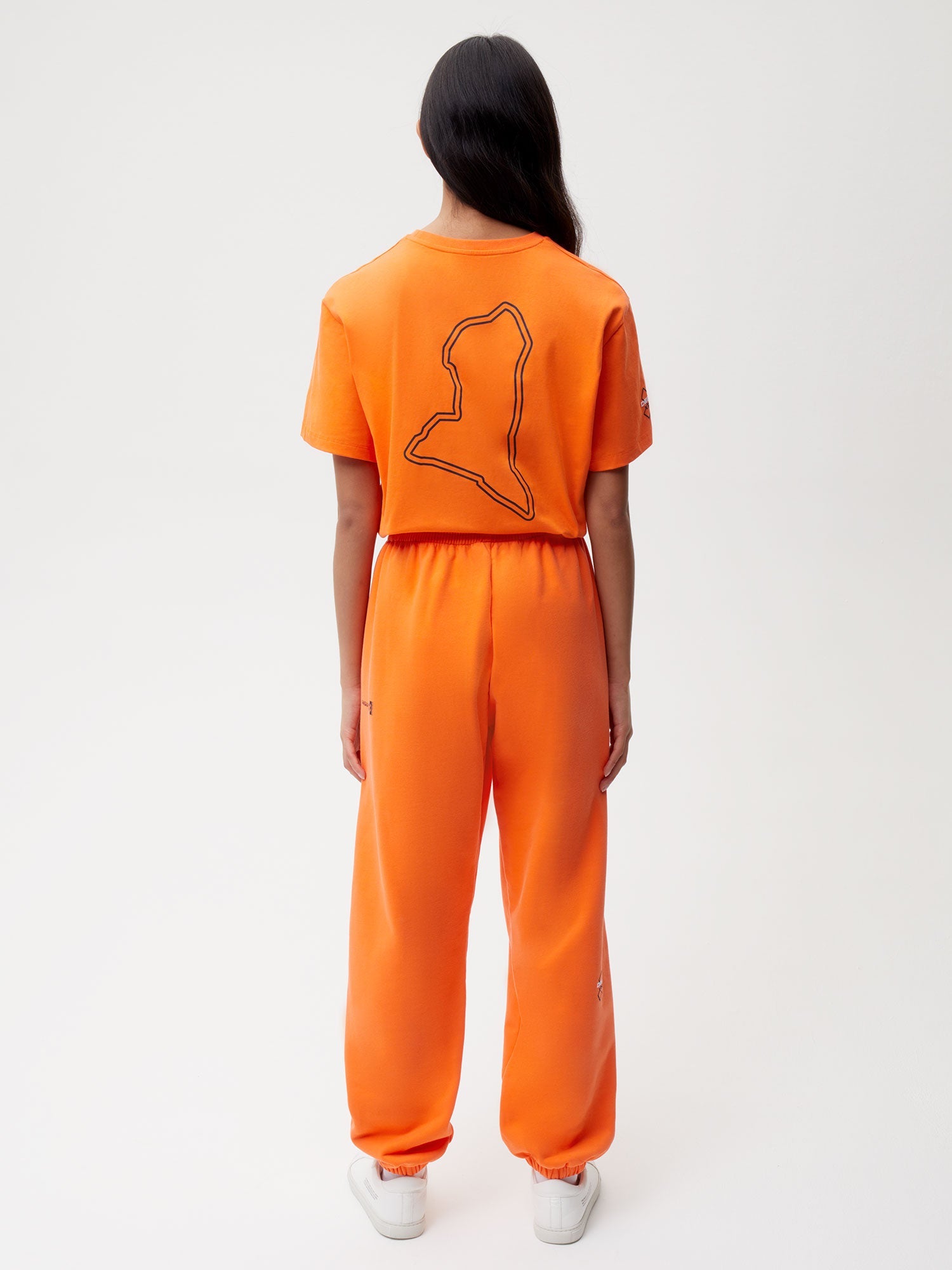 PANGAIA x Extreme-E Track Pants—persimmon orange female