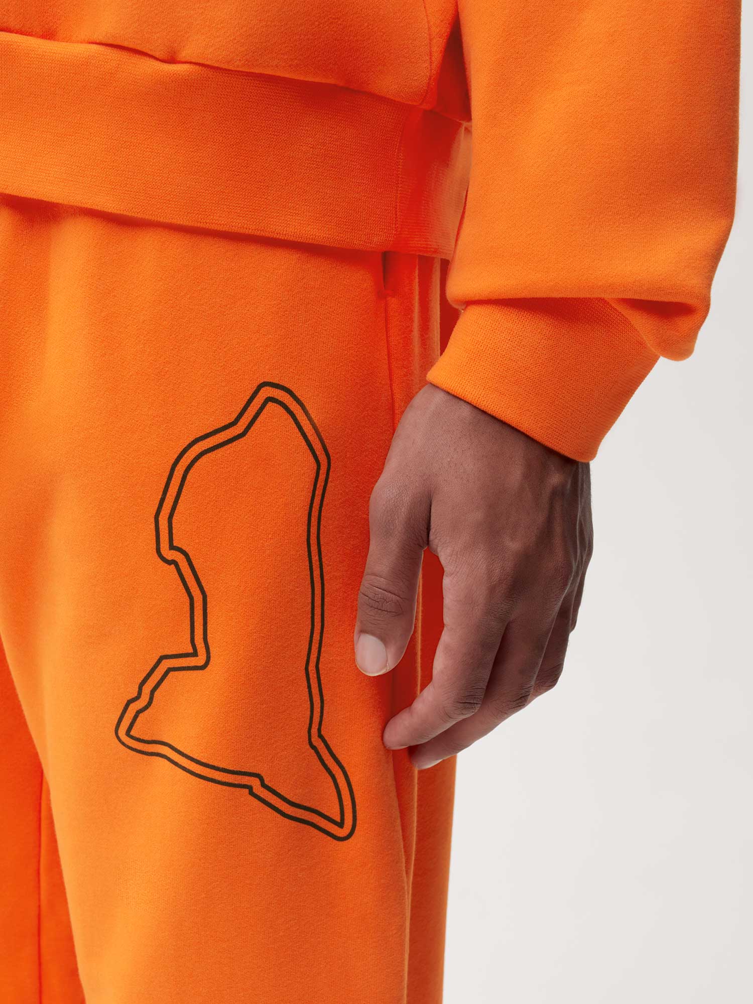 PANGAIA x Extreme-E Track Pants—persimmon orange male